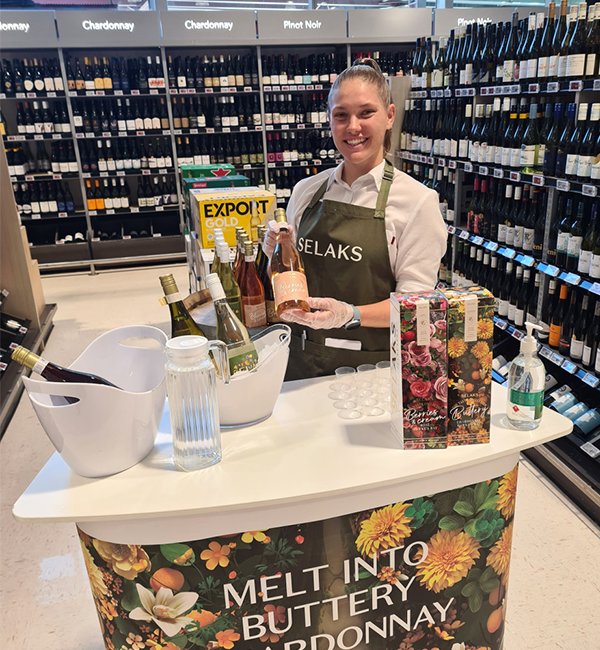 Brand ambassador product sampling Selaks wine in-store